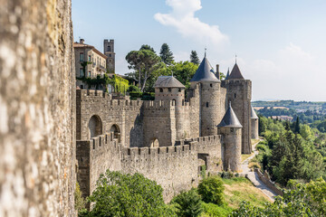 Scenic view of Carcassone medieval city in France against summer sky - obrazy, fototapety, plakaty