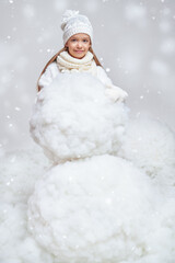 kid making snowman