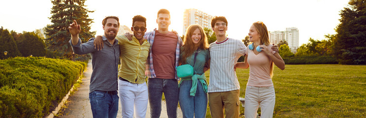 Happy young people enjoying summer, spending time outdoors and having fun together. Joyful excited...