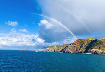 Coastal view and Atlantic Ocean with rainbow, Ponta da Ferraria, Sao Miguel island, Azores, Portugal