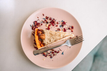 Tasty homemade cheesecake on plate on a table background at city cafe