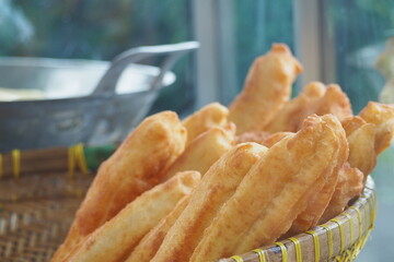 Youtiao also known as Chinese Oil Stick, Cakwe (in Malaysia, Indonesia and Singapore.) This golden brown long fried breadstick is a popular dish in Southeast Asia