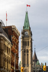 Canadian Parliament building with flag in Ottawa, Canada.
