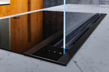 Control panel of Modern induction ceramic hob with integrated fan extractor