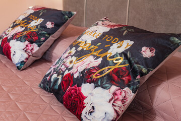 Two printed pillows at the headboard