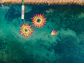 Aerial views with drone filming people kayaking off the coast of Europe.