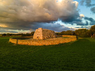 4k aerial views of the Naveta des Tudons, a prehistoric monument of the Balearic archipelago.