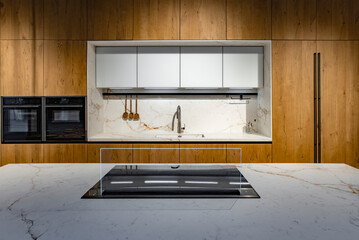 Kitchen set with white marble and black elements