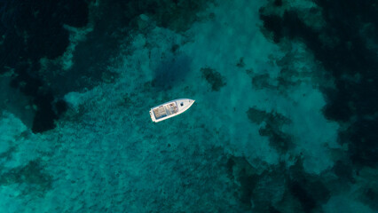 Fototapeta na wymiar aerial imagery 4k of land and sea with boats