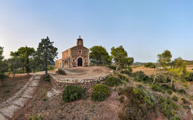 4k aerial views with drone. Monastery of Monte Toro, in the centre of the island of Menorca, Balearic Islands.