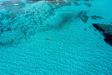 Aerial views with drone filming people kayaking off the coast of Europe.