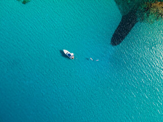 aerial imagery 4k of land and sea with boats
