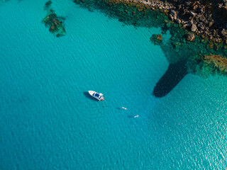 aerial imagery 4k of land and sea with boats