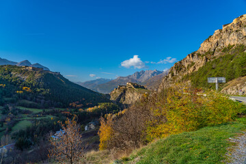 Landscape in the French southern alps in the middle of a large valley in autumn