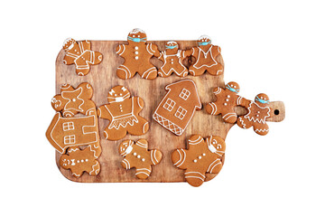 Gingerbread cookies on a wooden board isolated on whtie