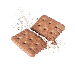 Delicious biscuit crushed into two halves in the air close-up