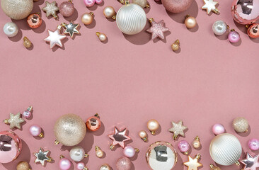 Fototapeta premium Christmas toys for fir tree on pink background. Merry Christmas and Happy New Year concept. Copy space for your text. Top view