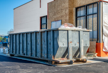 Commercial Dumpster Next To New Fast Food Store Construction