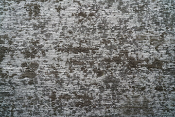 Brown and white colored carpet background with abstract pattern closeup view