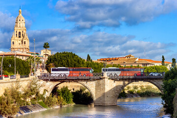 Obraz premium Panoramic view of the Puente de los Peligros in Murcia, with the lower Segura river and the Cathedral Tower in the background.