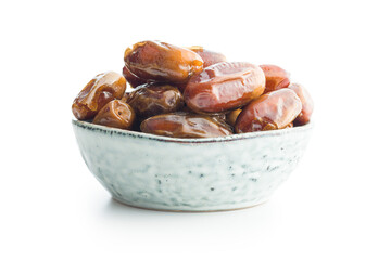 Dried dates fruit in bowl. isolated on white background.