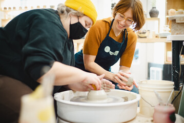 Class on modeling of clay on a potter's wheel In a ceramic workshop