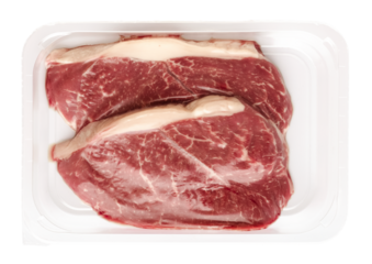 Fresh raw beef steaks in vacuum packaging on a transparent background. isolated object. top view