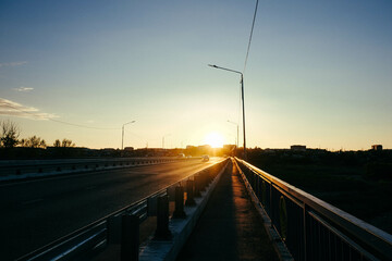 Fototapeta na wymiar the road at golden sunset