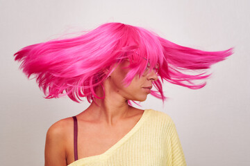 Woman with bright pink hair