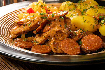 Stewed turkey meat with chorizo sausage.