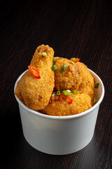 fried breaded chicken legs in bowl