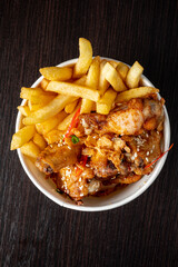 french fries with chicken and sauce