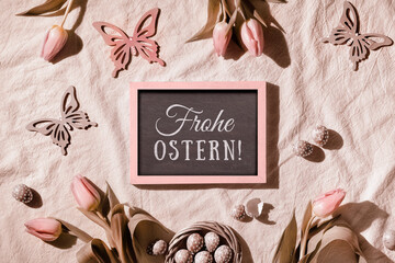Sepia tinted Easter background. Decorated background with blackboard. Text Frohe Ostern means Happy...