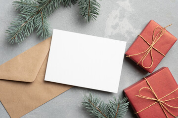 Christmas greeting card mockup with envelope and gift boxes
