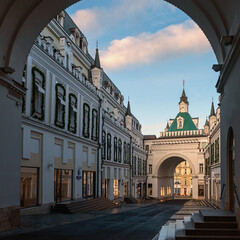 Fototapeta premium view from under the arch to a shopping street with branded stores in the center of Moscow, Russia