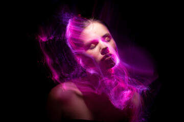 Abstract photography in the style of light painting. girl on a black background