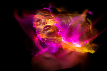 Abstract photography in the style of light painting. girl on a black background