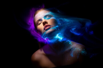 Abstract photography in the style of light painting. girl on a black background