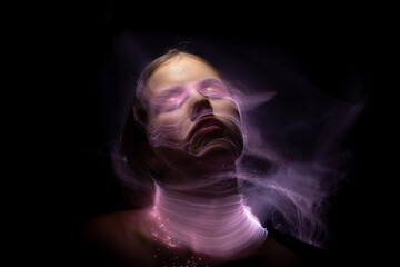 Abstract photography in the style of light painting. girl on a black background