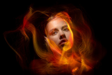 Abstract photography in the style of light painting. girl on a black background