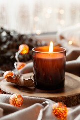 warm cozy window arrangement, winter or autumn concept, candles throw lights