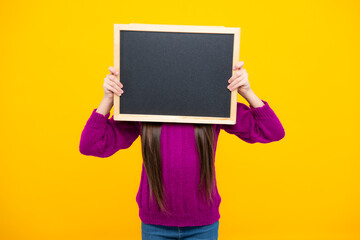 Teen schoolgirl hold blackboard. Child advertising. Back to school.