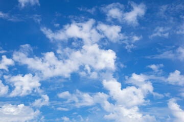 Naklejka na ściany i meble Beautiful white clouds in blue sky. Cumulus clouds
