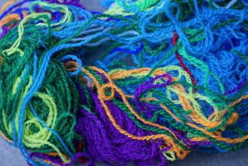 fabric texture of colored woolen threads in a pile