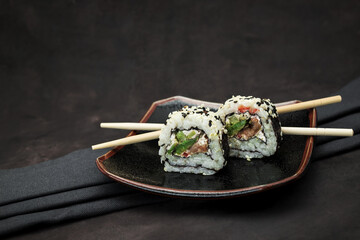 A set of delicious sushi on dark background