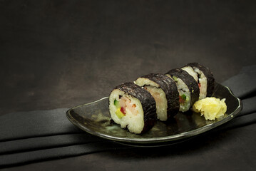A set of delicious sushi on dark background