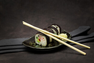 A set of delicious sushi on dark background