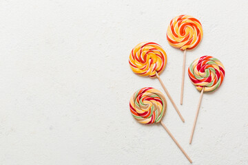 Set of colorful lollipops on colored background. Summer concept. Party Happy Birthday or Minimalist...