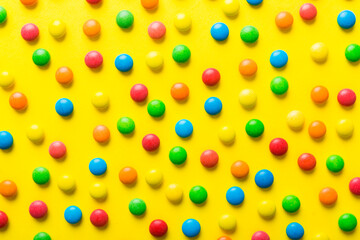 colorful candies as background top view. Seamless pattern with candy. Many sweet candies close-up