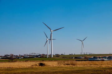 Wind turbines in a village. Renewable energy